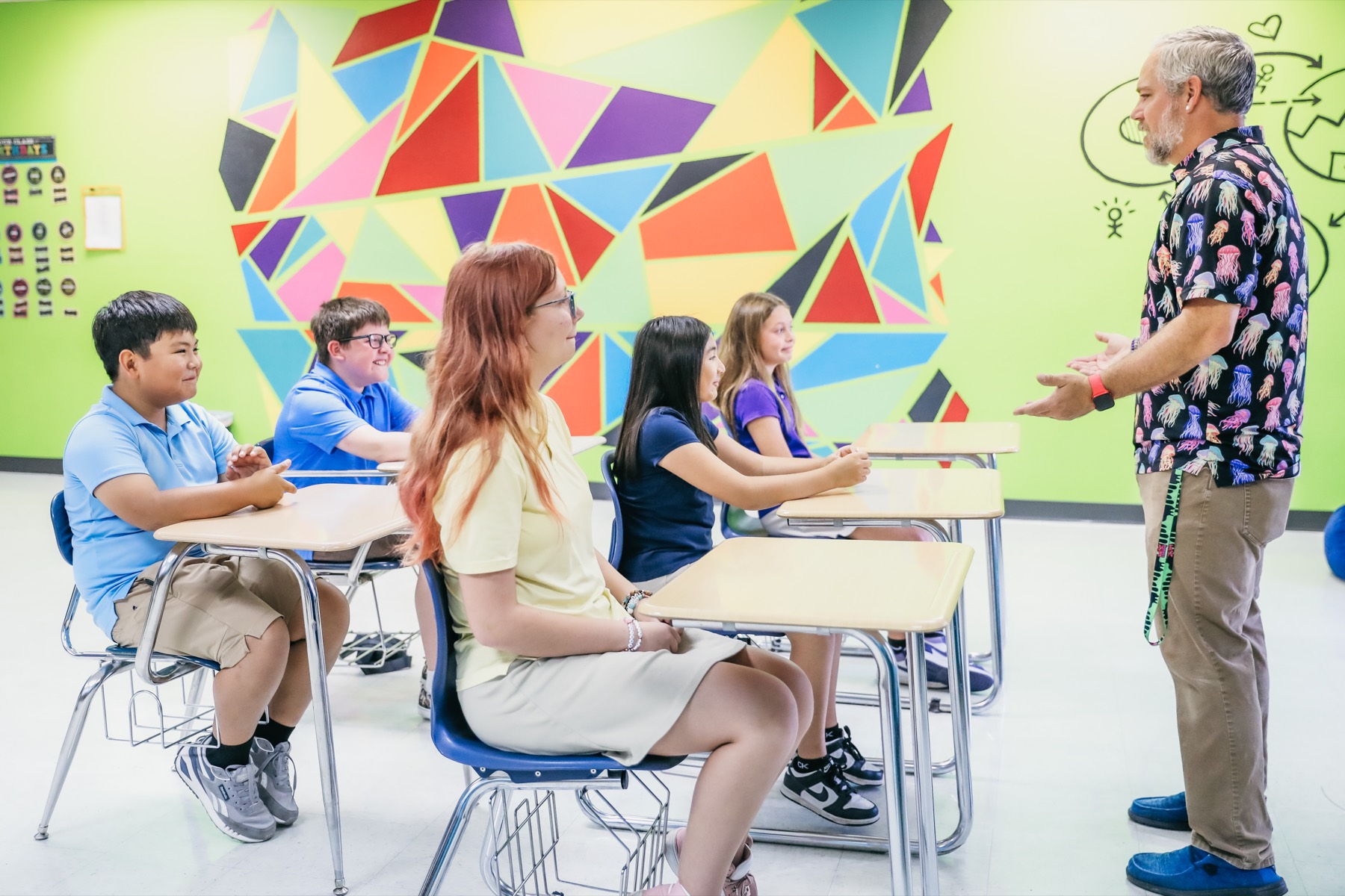 A teacher working closely with a student at Trinity Christian Academy